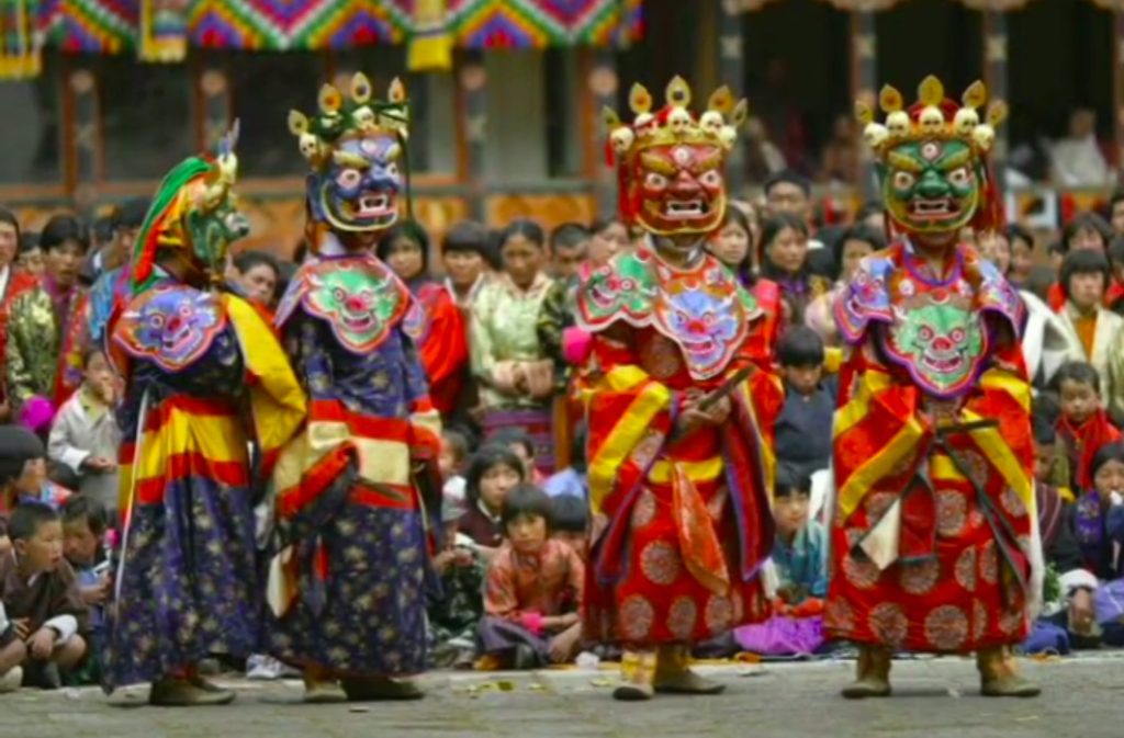 Bardo Chham Dancer Wearing Colorful Masks